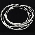Six Silvertone Textured Interlocking Bracelets