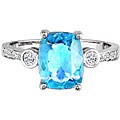 14k Gold Blue Topaz and 1/10ct TDW Diamond Ring