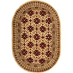 Hand-tufted Classic Kashan Beige Wool Rug (7'6 x 9'6 Oval).