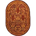 Handmade Majestic Burgundy Wool Rug (4'6 x 6'6 Oval)